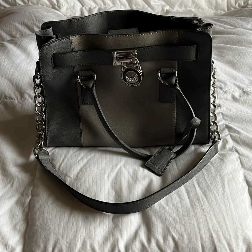 Vintage Michael Kors purse with matching wallet. Silver detail. Good condition